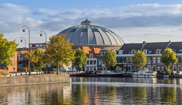 Haarlem, Netherlands - 16 August 2026: Panoramic view of former panopticon prison De Koepel dome across Spaarne canal.