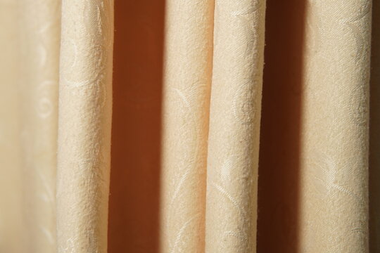 creamy beige fabric curtains with floral pattern texture. elegant home decor textile backdrop