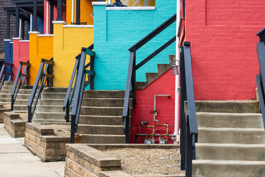 Colorful urban row houses with steps leading up