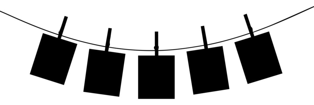 Black silhouette of five square photo frames hanging on a curved clothesline with clothespins isolated on white background