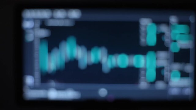 Blurred Medical Monitor Interface Glowing Blue Teal Bokeh