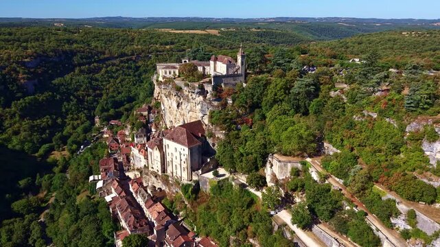 Drone advances toward Rocamadour revealing its sanctuary and cliffside homes