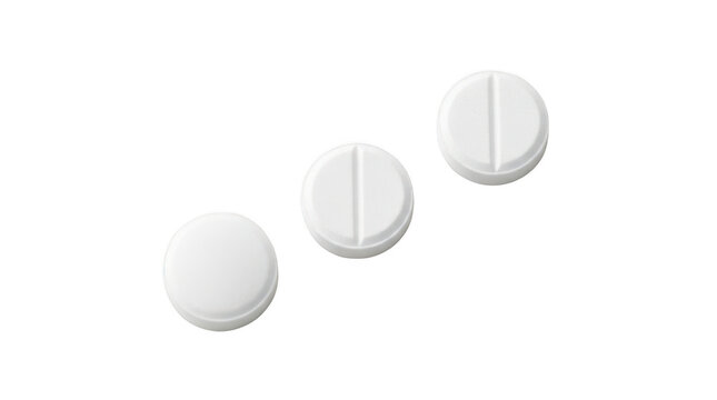 Three white round tablets with a score line for easy splitting isolated on transparent background