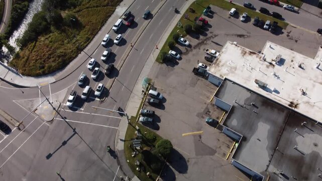 Motorcycle riders on road busy traffic tilt aerial