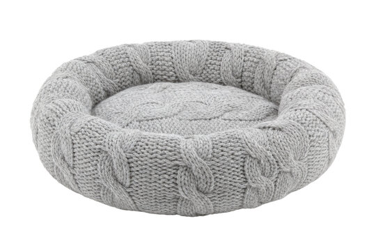 Round gray knitted pet bed with a cozy cable knit pattern, isolated on a clean white background