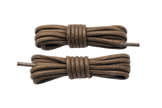 Two neatly coiled brown braided shoelaces with metal aglets are precisely arranged on a clean white background, captured with bright studio lighting
