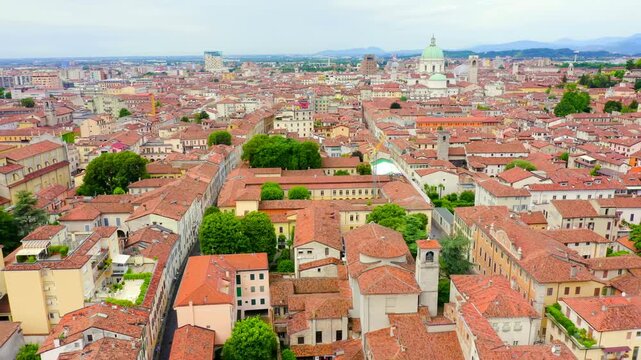 Brescia, Italy. Arnaldo Square. Flight over the city in cloudy weather. Drone footage, Departure of the camera