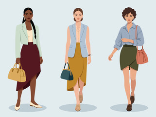 Obraz premium Three elegant diverse women posing in stylish smart casual business outfits with trendy handbags