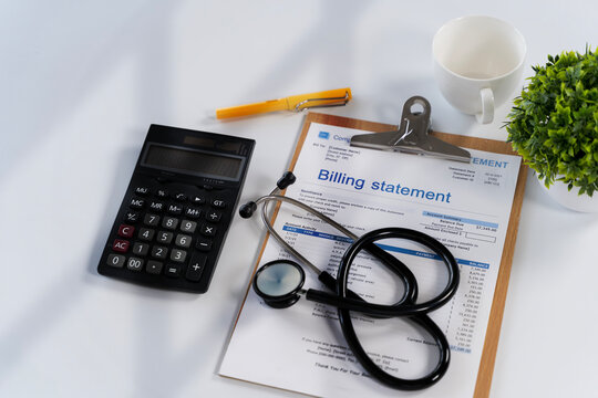 Medical Billing Statement with Stethoscope and Calculator on Office Desk