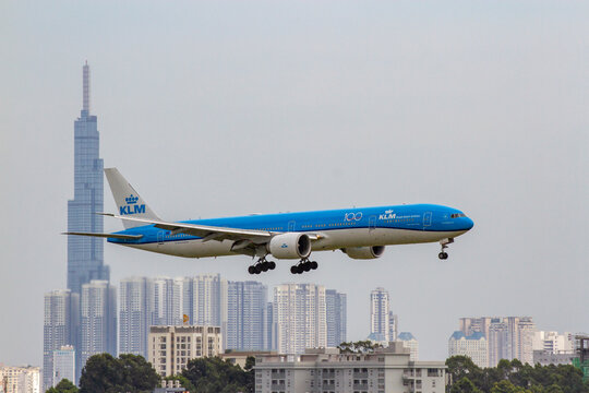 Ho Chi Minh City, Vietnam - August 15, 2020 : A Boeing 777-300ER Airplane of KLM Royal Dutch Airlines with Registration PH-BVP Landing at Tan Son Nhat International Airport with Landmark 81 in the Bac