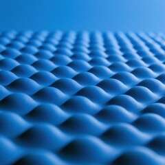 Obraz premium A blue grid of rounded bumps fills the space with texture, set against a minimal backdrop in a well-lit area.