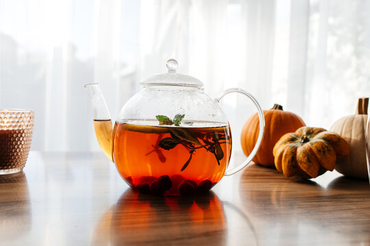 Autumn tea set with pumpkins and knitted scarf