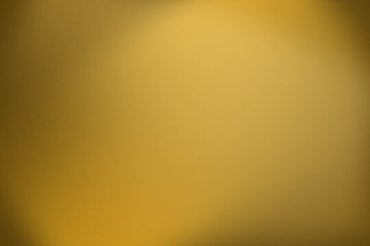 Blurred golden yellow background with soft focus and subtle texture for design