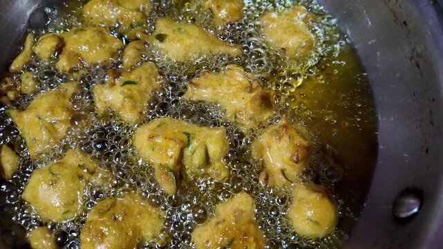 Close Up View of Crispy Indian Fritters Frying