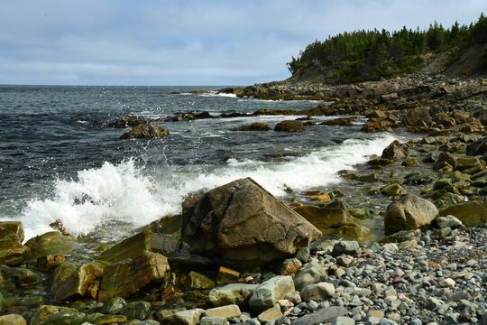 hiking the rocky shoreline of witless bay from gallows road along the irish loop on the avalon peninsula in summer in newfoundland, canada