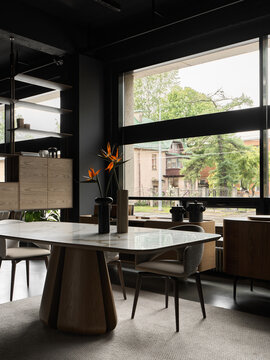 Modern dining room with marble table and floral centerpiece