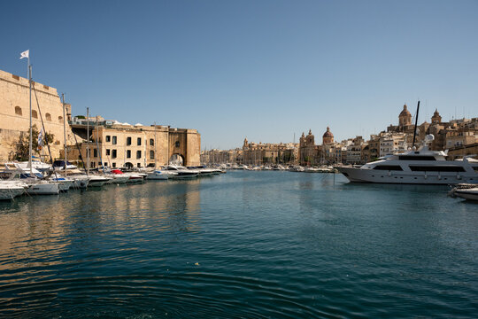 Luxury yachts in a historic Mediterranean port