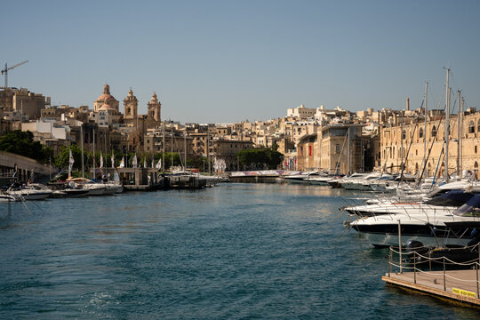 Boats moored in the historic Birgu harbor in Malta