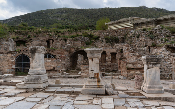 Marble columns and ancient ruins of the Prytaneion at the archaeological site of Ephesus in Selcuk, Izmir, Turkiye under a cloudy sky