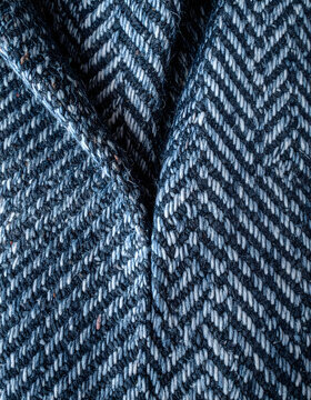 Herringbone tweed pattern showing tight interlocking threads with refined tailored mood generative AI