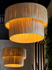 Obraz premium Warm light shines from two layered hanging lamps