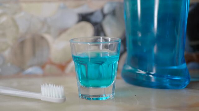 Using mouthwash and a toothbrush at home