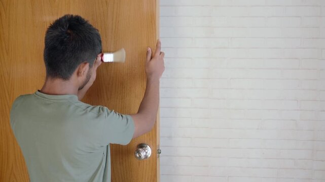 Man paints door in home improvement project