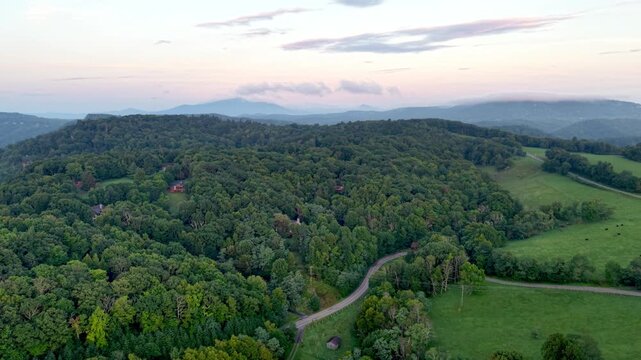 aerial push in toward grandfather mountain in the distance in north carolina near boone nc