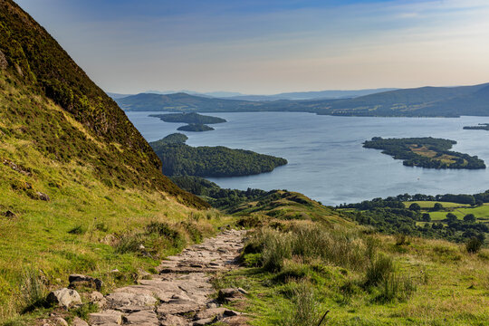 View from Conic Hill near Balmaha onto Loch Lomond in the Loch Lomond and the Trossards National Park, Scotland, in evening light.
