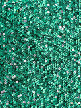 Bright green sequin fabric texture background