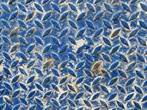 Blue weathered diamond plate texture background
