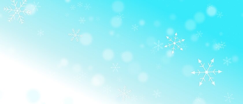 シアンの冬の雪の結晶と降雪ボケ味のホリデー背景