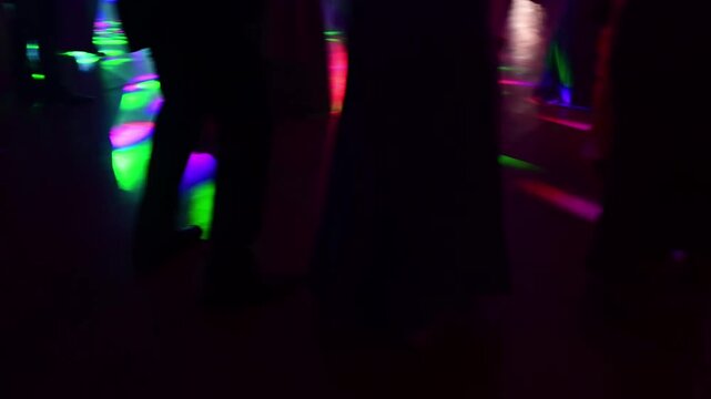 Unrecognizable people dancing in a nightclub