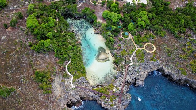 Aerial View of Crystal Clear Turquoise Saltwater Lagoon Weekuri in Sumba