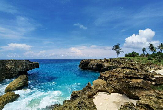 Ocean Waves Crashing Through Narrow Cliff Entrance at Mandorak Beach