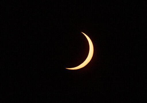 Crescent sun glows during a partial solar eclipse