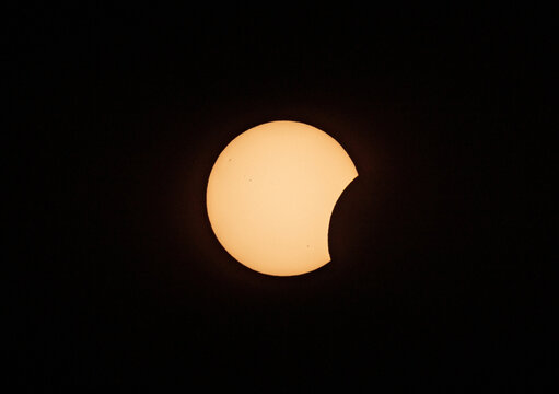 Dramatic Partial Solar Eclipse Background with Sharp Moon Silhouette
