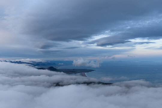 Moody Icelandic coast seen from above the clouds
