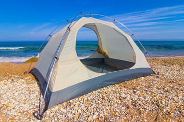 closeup touristic tent stay on the sea coast © Yuriy Kulik