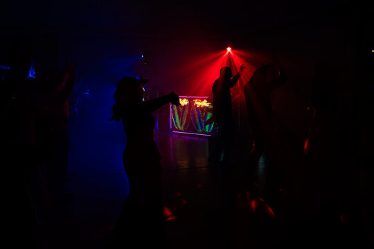 Unrecognizable people dancing in a nightclub