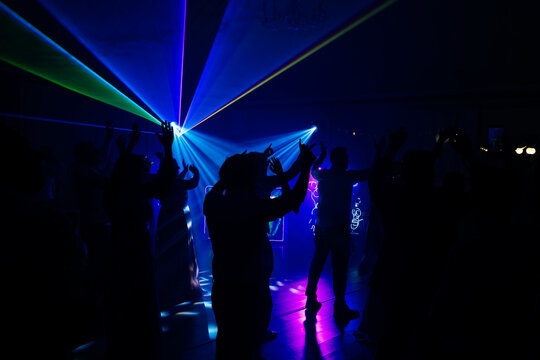 Unrecognizable people dancing in a nightclub