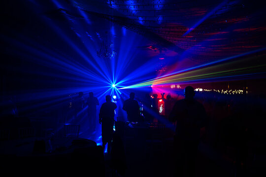 Unrecognizable people dancing in a nightclub