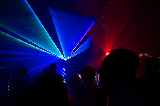 Unrecognizable people dancing in a nightclub