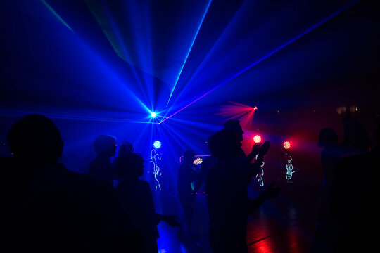 Unrecognizable people dancing in a nightclub