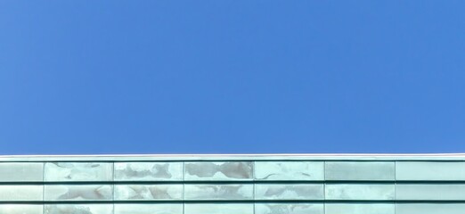 Copper facade with green patina under blue sky © photoopus