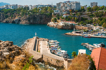 Naklejka premium Historic Kaleici Marina beneath coastal cliffs overlooking Mediterranean Sea in Antalya