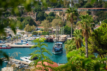 Naklejka premium Scenic Kaleici Marina surrounded by lush greenery in sunny Antalya Turkey
