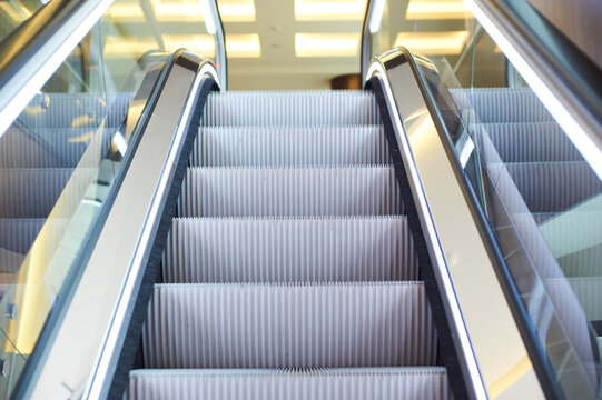 Modern Escalator with Illuminated Handrails Perspective View in Building