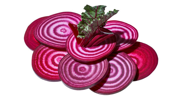 Chioggia beet slices with concentric rings and green leaves, isolated on transparent background