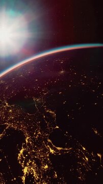 Bright lights illuminate urban areas of Earth as sunlight casts a glow over the planets horizon. This view captures the beauty of nighttime across continents and oceans.